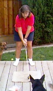 MJ plays golf on back deck